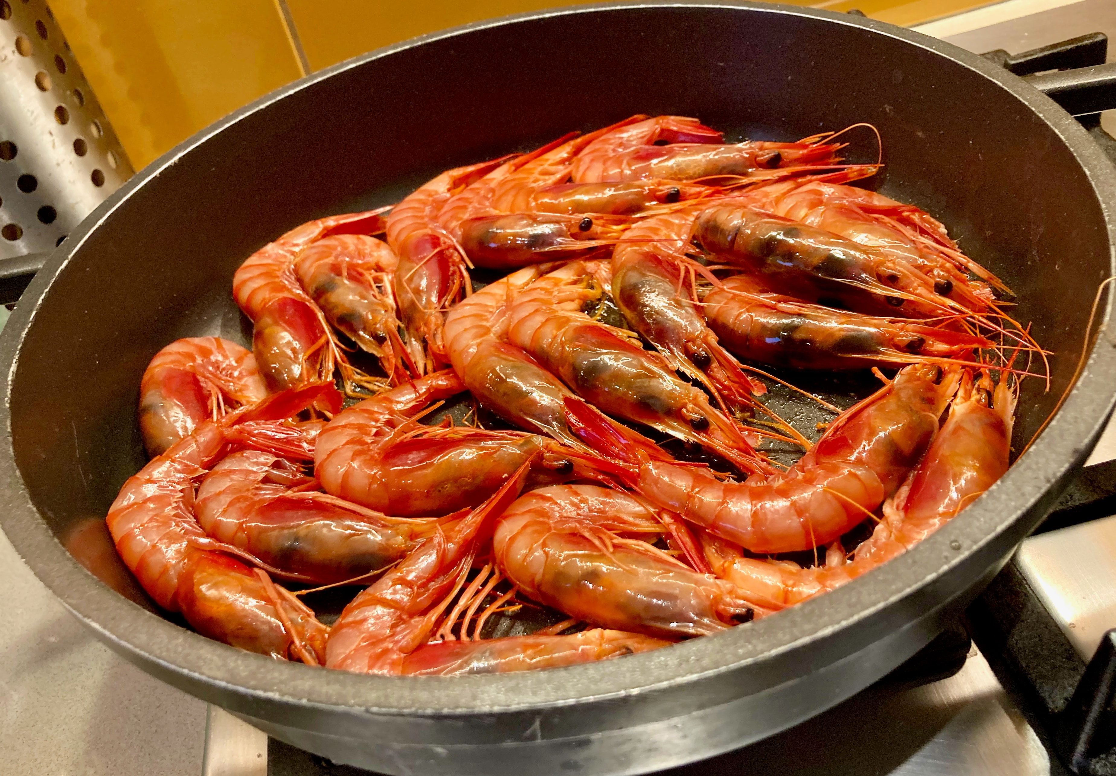 Fresh prawns in a pan on the stovetop